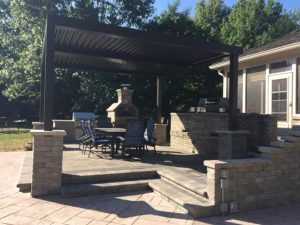 Raised Paver Patio with Outdoor Kitchen