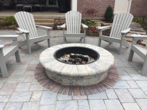 Wood Burning firepit with chairs around it