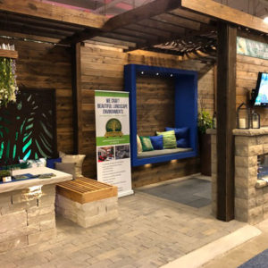 Capehart Indy Home Show 2020 display with blue decorative couch and Capeheart information banner